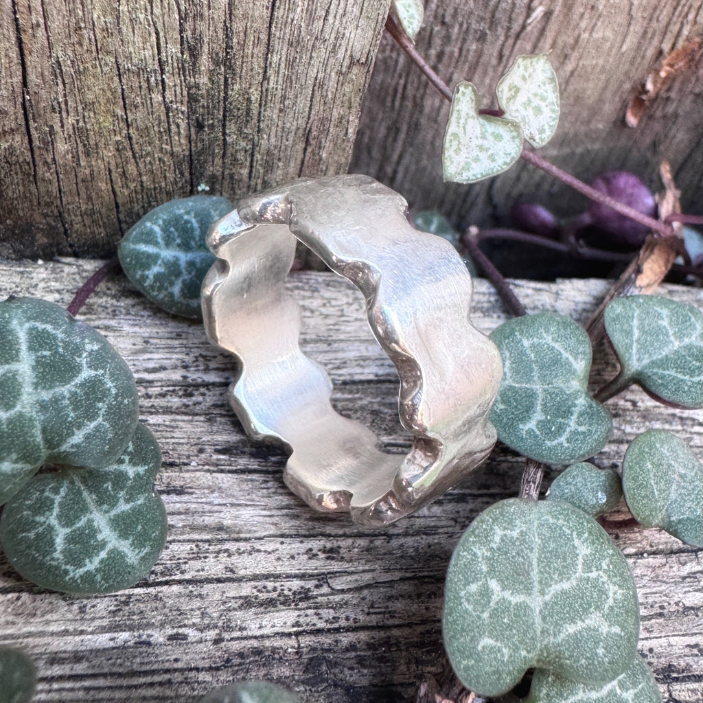 Rampart — hand-cast sterling silver ring with castle battlement notches and dark patina