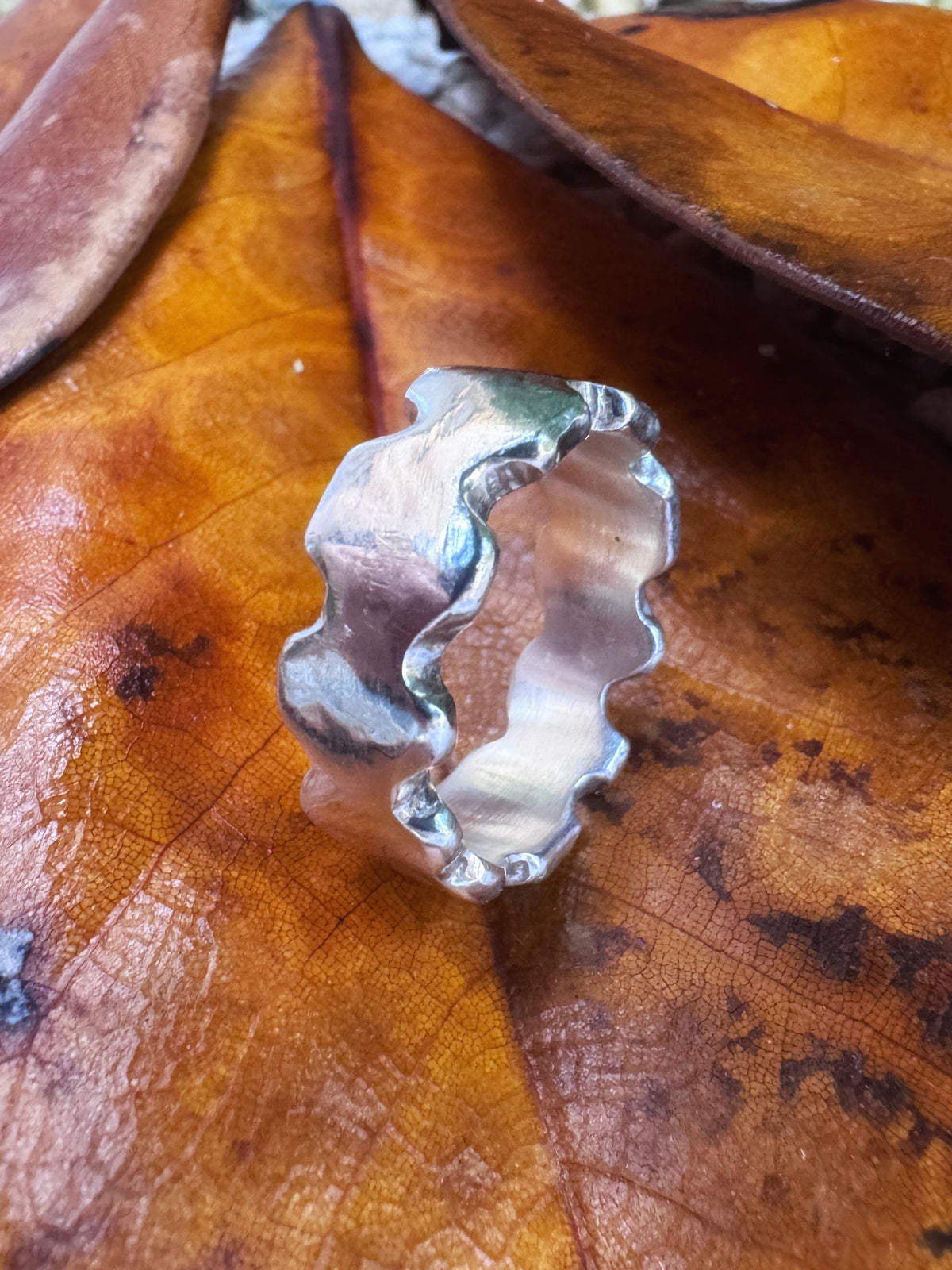 Rampart — hand-cast sterling silver ring with castle battlement notches and dark patina