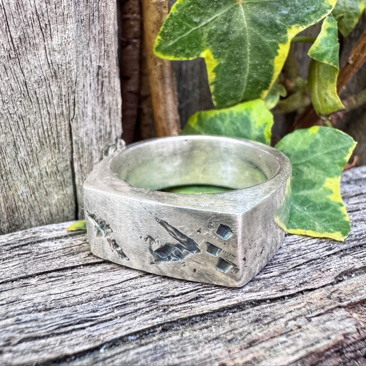 Tally hand-cast sterling silver signet ring with cut marks in the face
